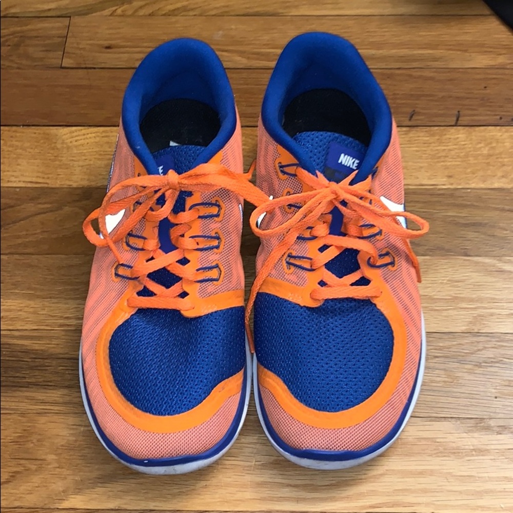 Orange and blue custom Nike sneakers.